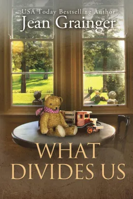 What Divides Us: The Kilteegan Bridge Story - Book 2 Hardcover  September 26, 2022